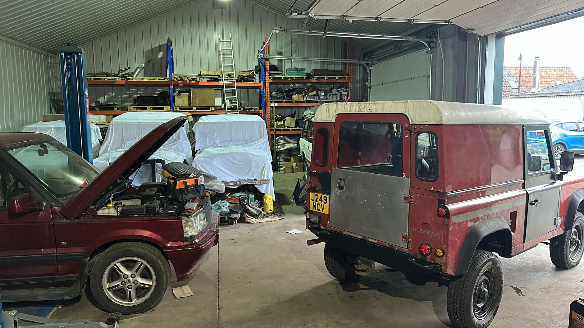 Defender 110 and Range Rover P38 in the workshop