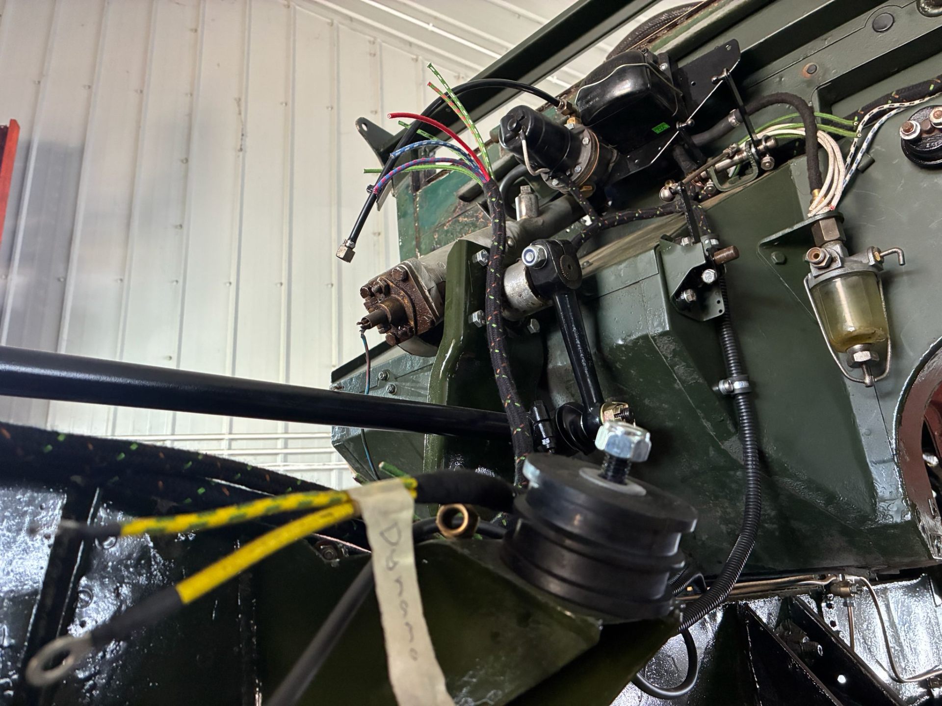 Close-up of Series Land Rover bulkhead and fuel filter
